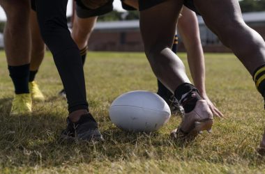 men-playing-rugby-field